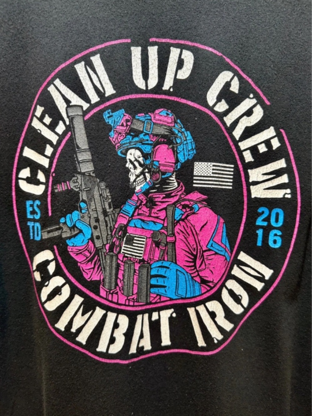 Combat Iron 'Clean Up Crew' Black Graphic Tee with Pink & Blue Badge